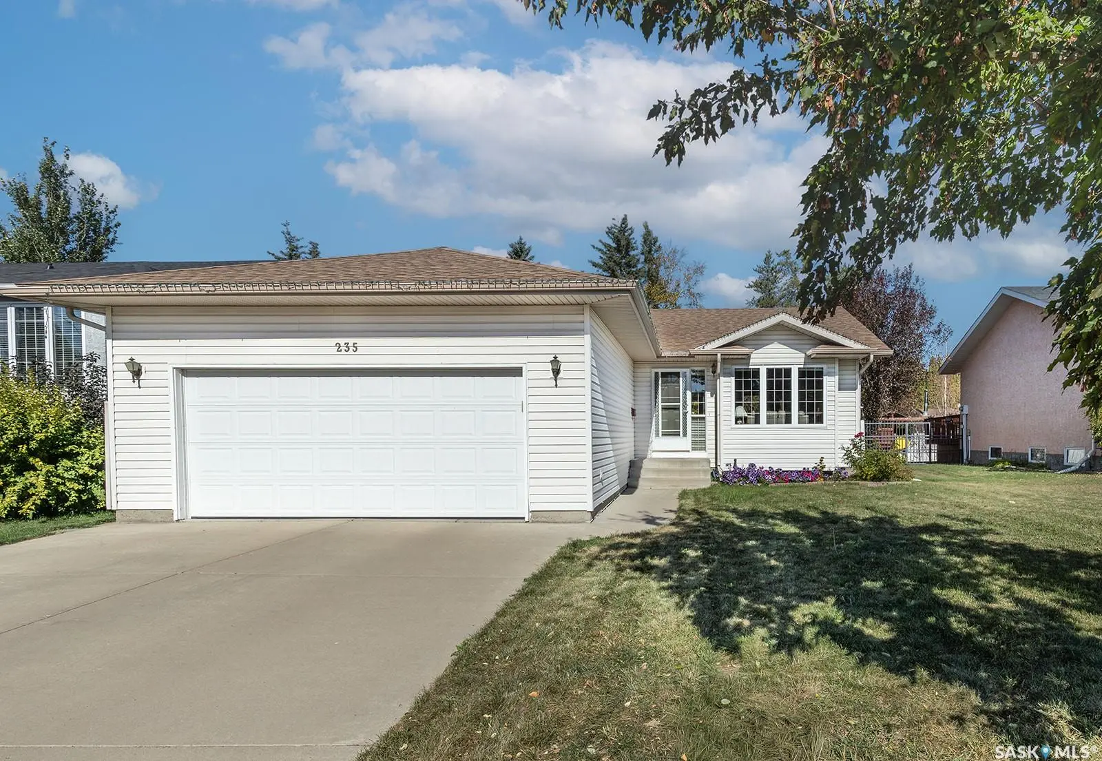 Exterior photo of 235 Konihowski Road, Saskatoon, SK bungalow with double garage in Silverspring neighborhood.